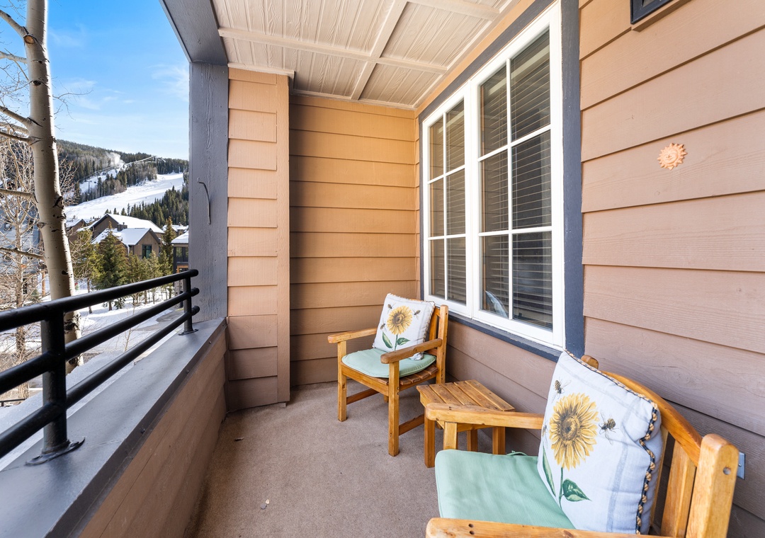 Your private balcony offers snowy mountain views and comfortable seating for morning coffee or evening relaxation.