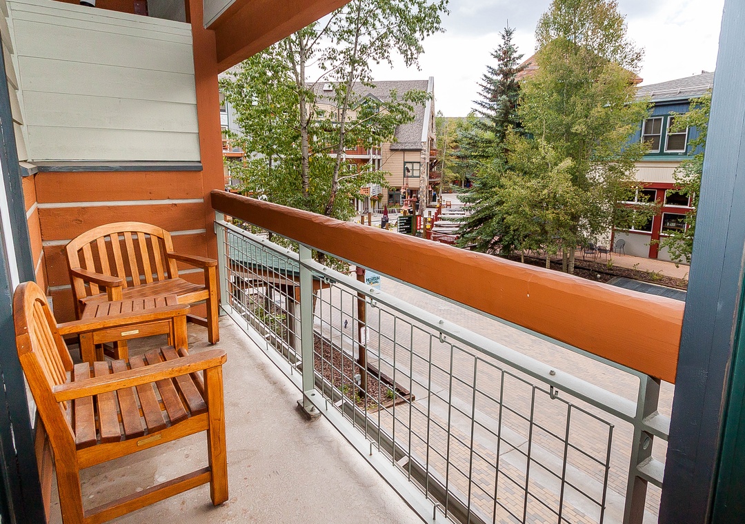 Step onto your private balcony and settle into comfortable teak chairs while taking in the charming neighborhood views.