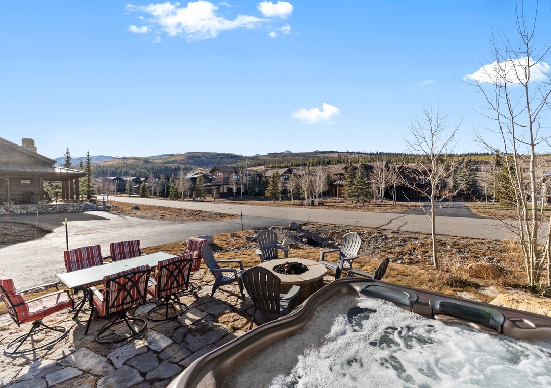 Soak in your private hot tub while taking in stunning mountain views, then gather around the fire pit for cozy evenings under the stars.