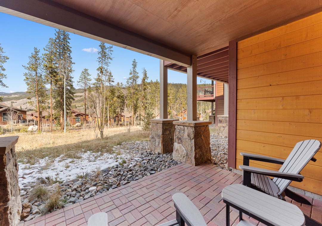 Step onto your covered patio and breathe in the crisp mountain air while relaxing in comfortable Adirondack chairs.