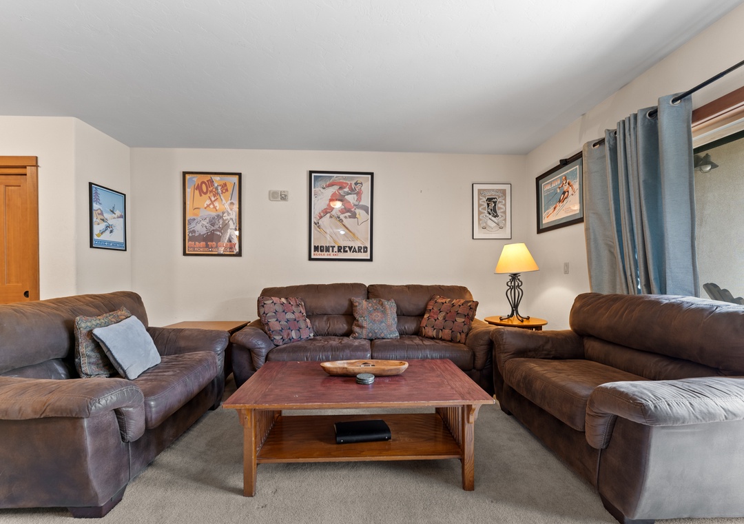 Sink into plush leather sofas in your spacious living room, where vintage ski posters set the tone for mountain adventures ahead.