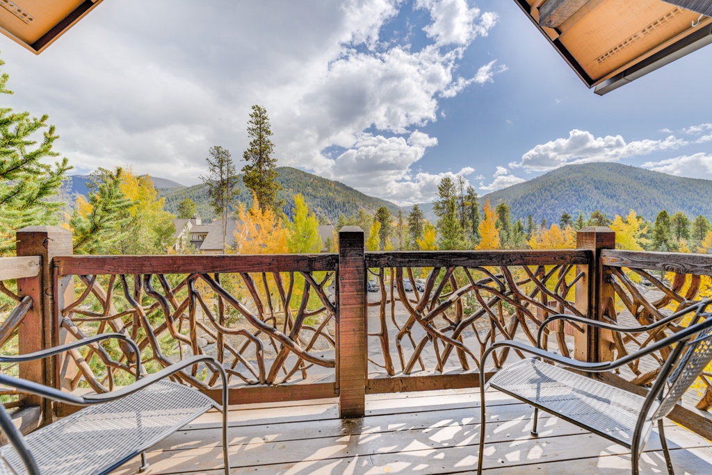 Step onto your private balcony and soak in breathtaking autumn mountain views through artistic railings, where golden aspens frame the perfect retreat.