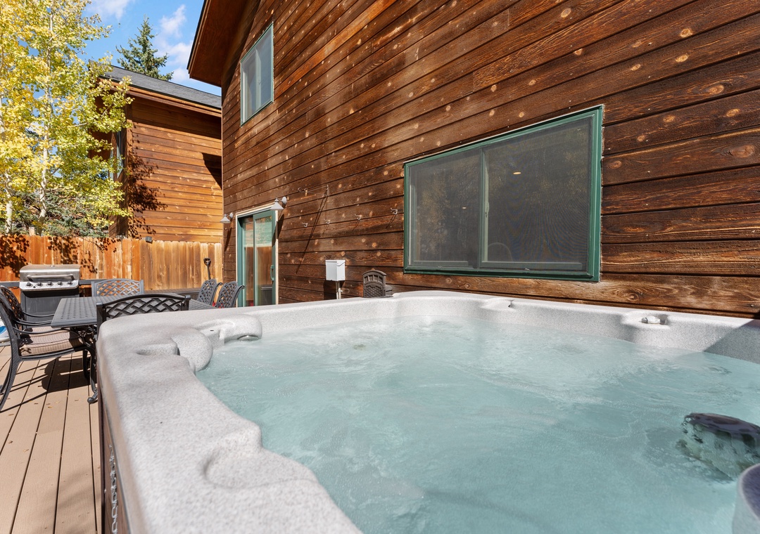 Slip into your own private hot tub on the deck, surrounded by warm wood and mountain air—perfect for unwinding after a day of adventure.