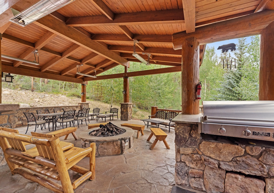 Gather around your private fire pit or fire up the BBQ in this stunning covered patio surrounded by forest views.
