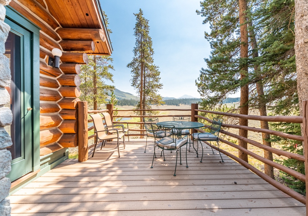 Step onto your private mountain deck and breathe in the fresh alpine air while enjoying coffee at the outdoor table.