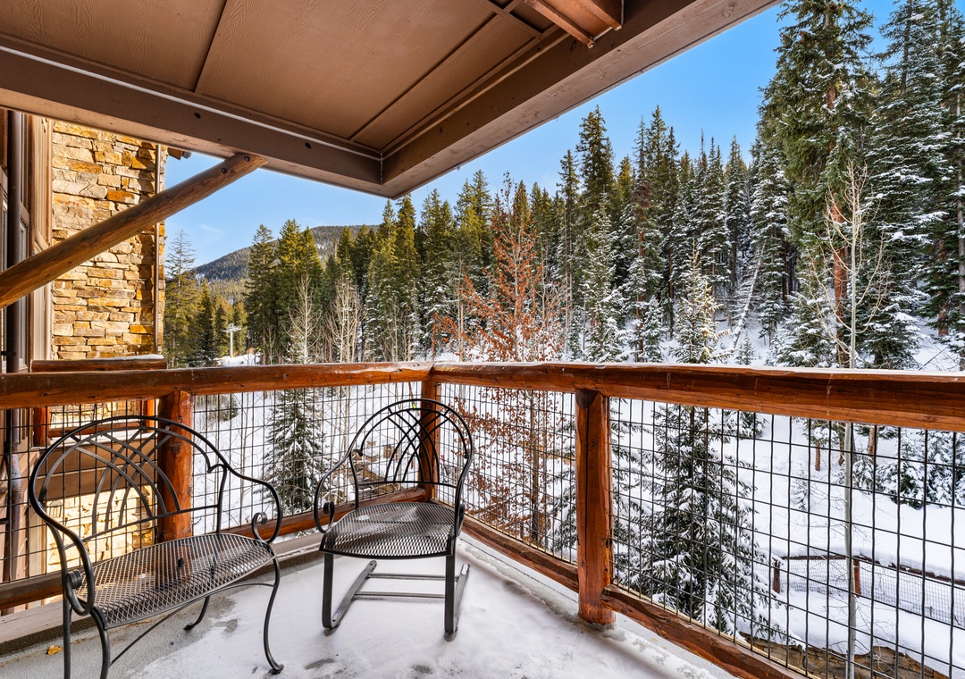 Step onto your private balcony and breathe in crisp mountain air while taking in stunning winter forest views.
