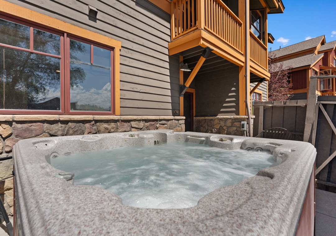 Slip into your private hot tub under blue mountain skies. The perfect spot to unwind after a day of adventure, surrounded by fresh alpine air.