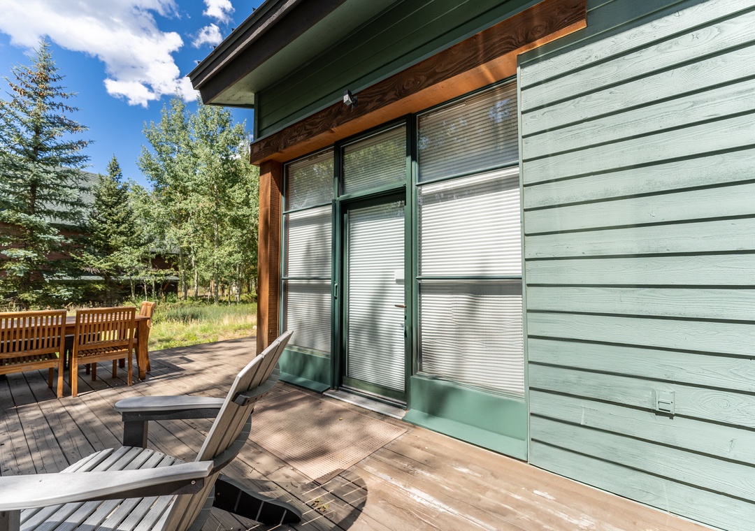 Relax on your private deck with mountain forest views, complete with outdoor seating for morning coffee or evening drinks.