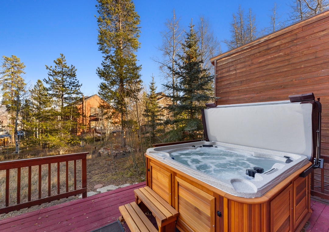 Soak away your cares in your private hot tub, surrounded by towering pines and mountain air on this peaceful deck.