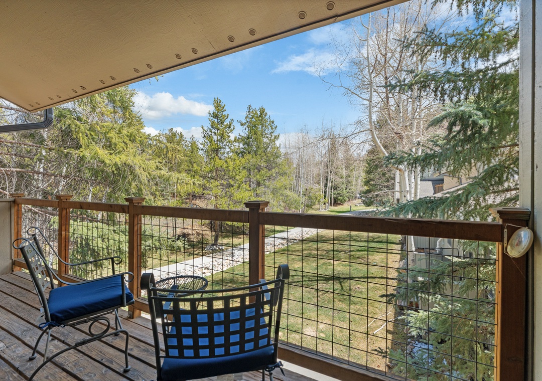 Unwind on your private balcony with serene views of evergreens and neighboring properties. Sip your morning coffee surrounded by fresh mountain air and natural beauty.