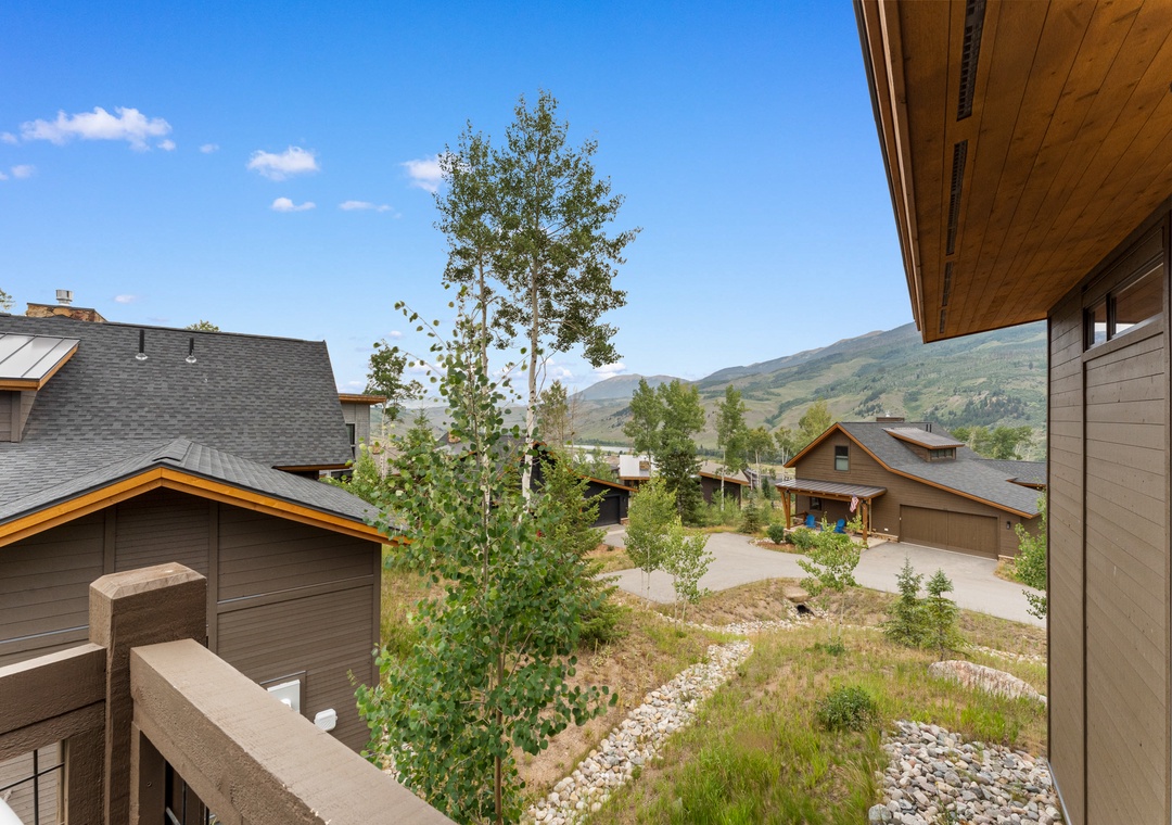 Stunning mountain views stretch across the valley from this peaceful balcony, where rolling hills create a perfect backdrop for your morning coffee.