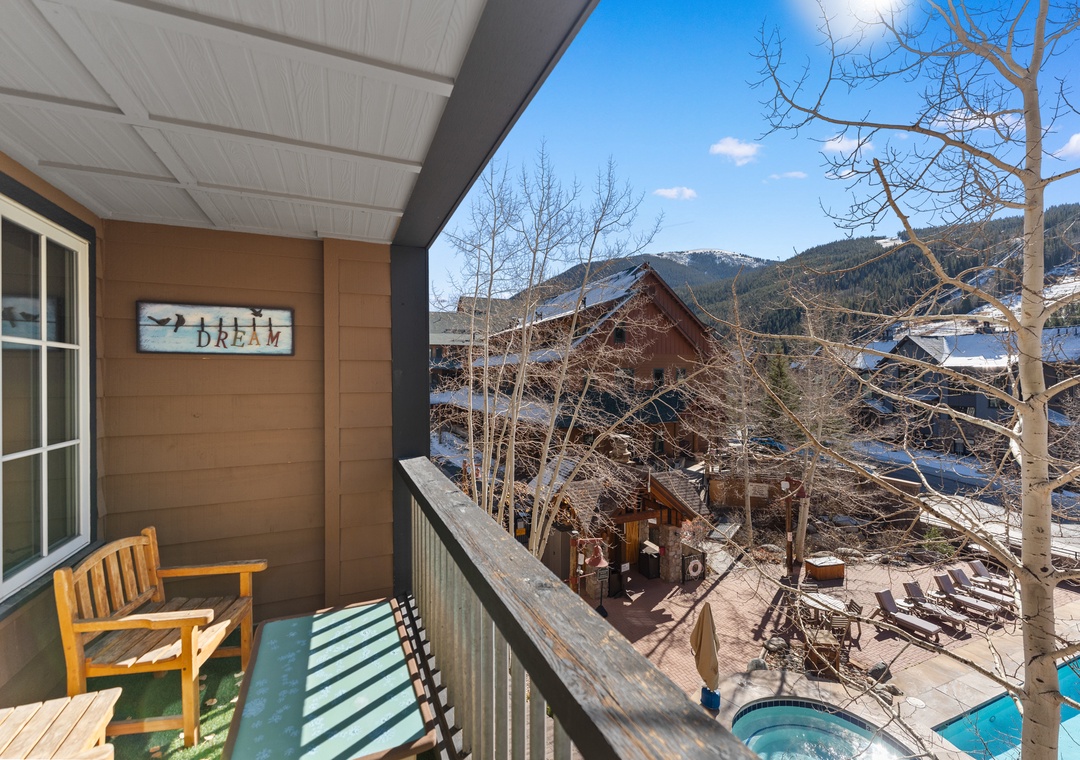 Relax on your private balcony with stunning mountain views and glimpses of the pool area below.