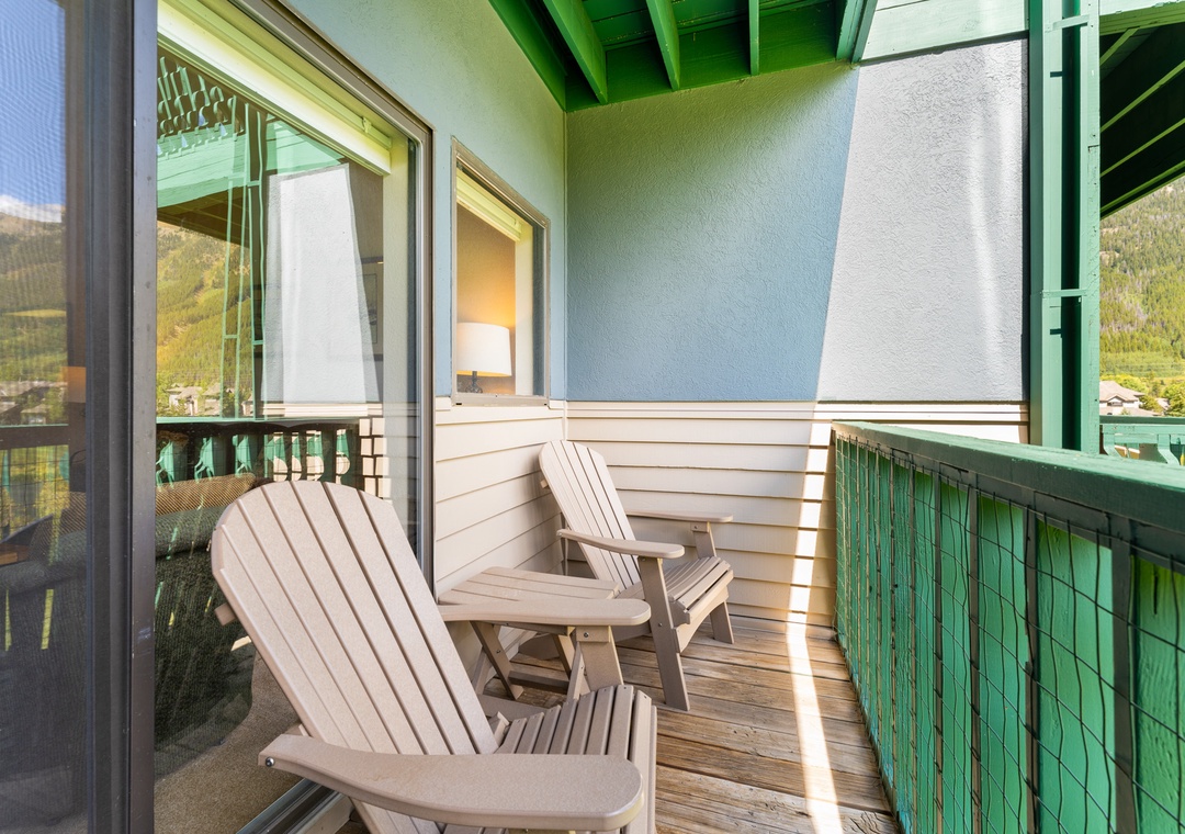 Your private balcony with comfortable Adirondack chairs offers the perfect spot to unwind while enjoying mountain views and fresh air.