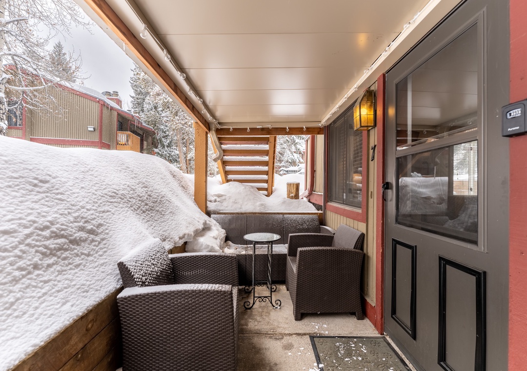 Cozy up in this protected outdoor seating area where you can enjoy fresh mountain air while staying warm and sheltered from snow.