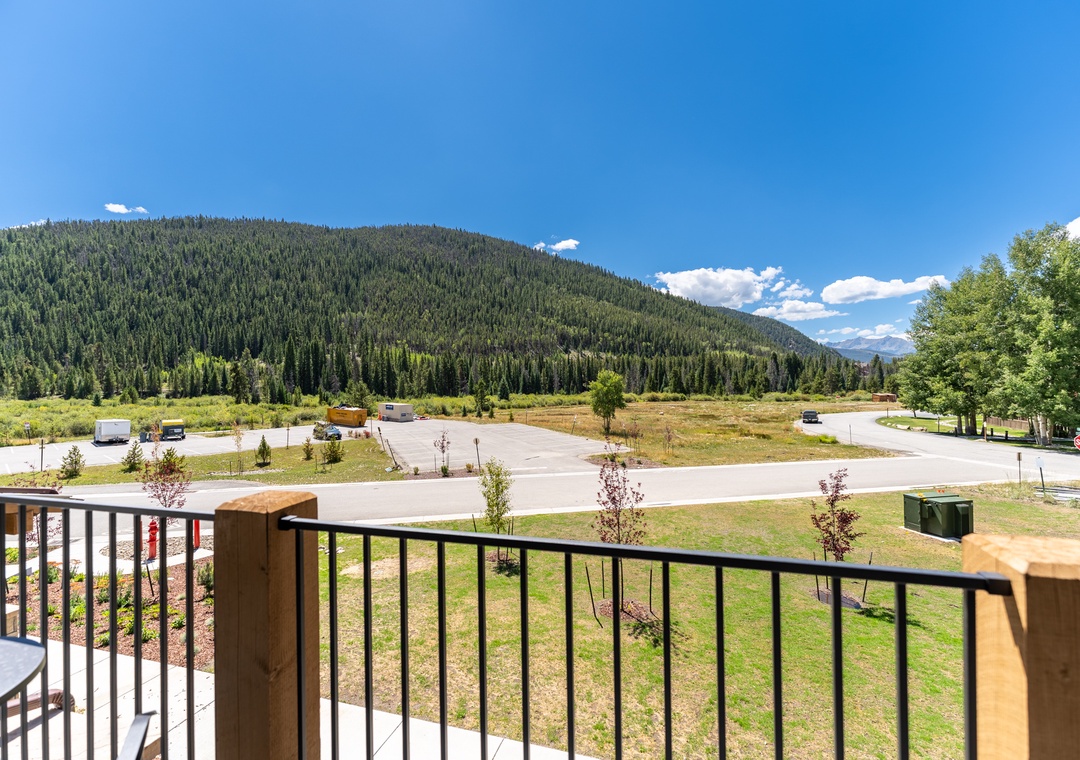 Step onto your private balcony and breathe in the fresh mountain air while taking in stunning views of forested peaks.