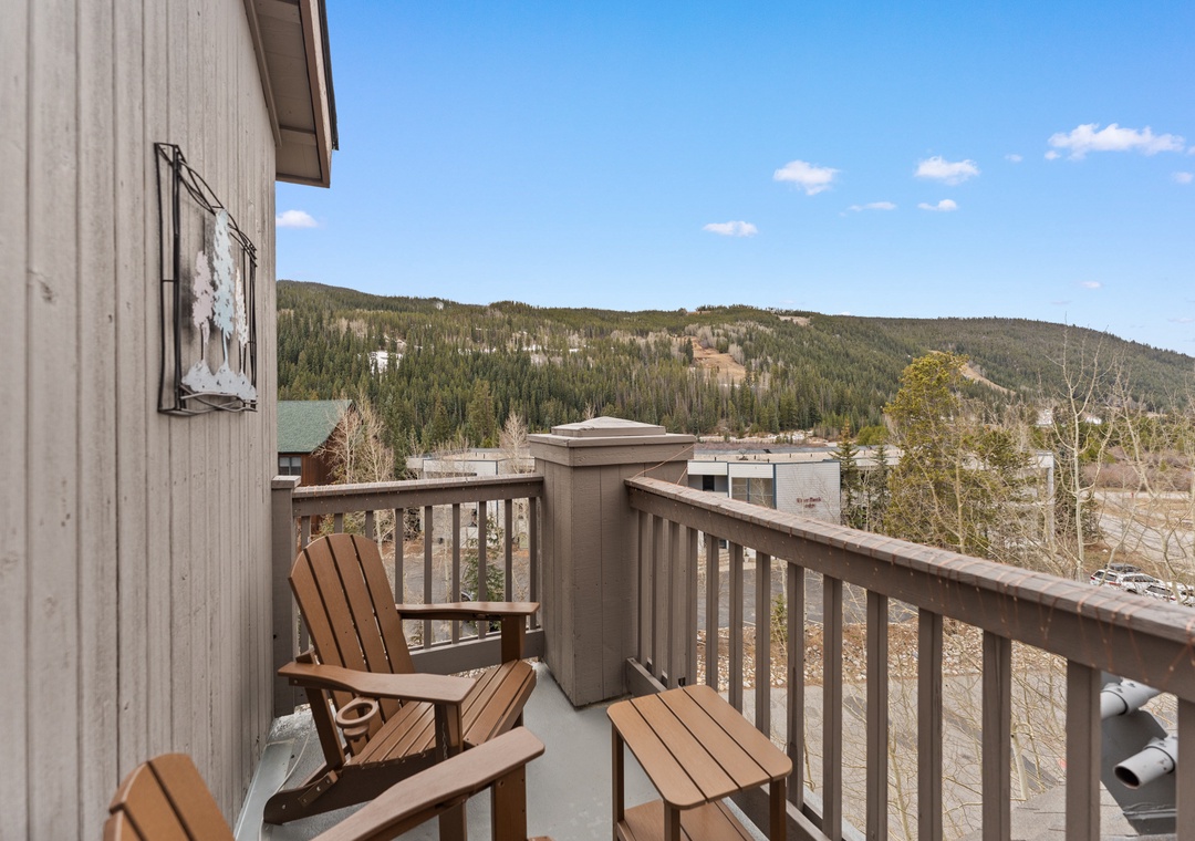 Relax in your private mountain retreat with stunning panoramic views and peaceful outdoor seating.
