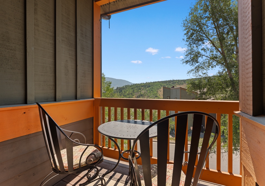 Your private balcony invites you to sip morning coffee while gazing at lush forested hills and breathtaking mountain views—a peaceful escape framed by nature.