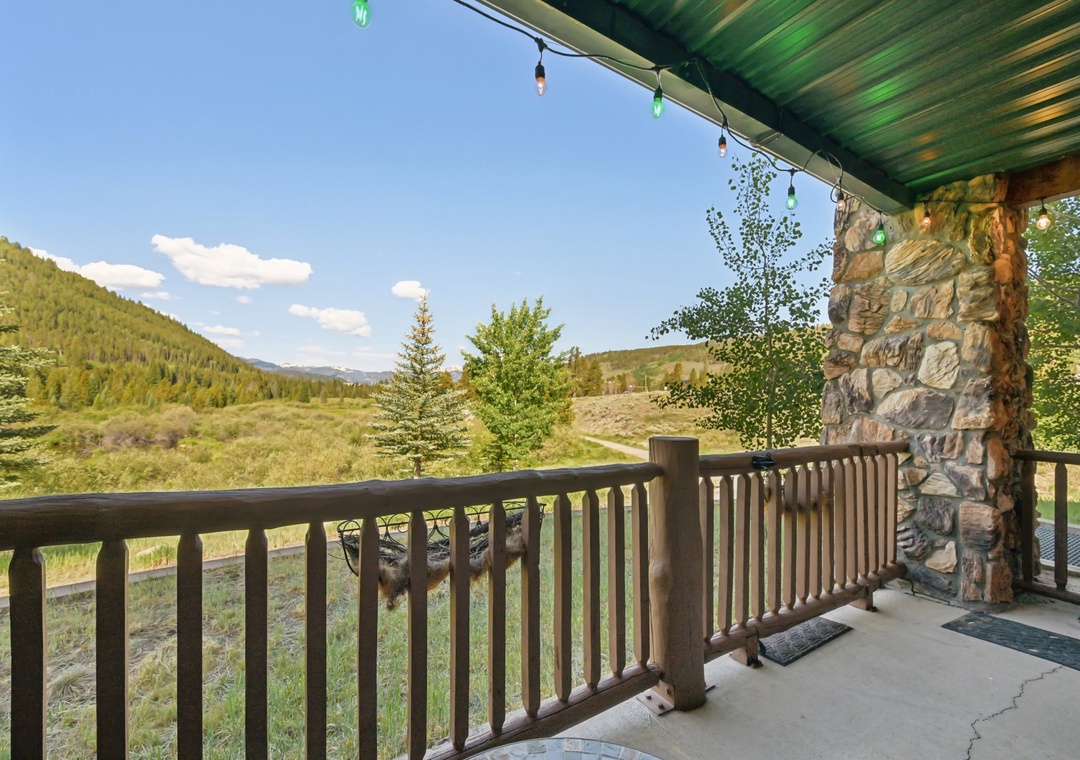 Relax on your private balcony with sweeping mountain views, where string lights create magical evenings and nature's beauty unfolds before you.