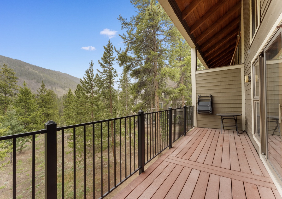 Your private deck offers stunning mountain views where you can unwind with morning coffee or evening barbecues surrounded by peaceful forest scenery.