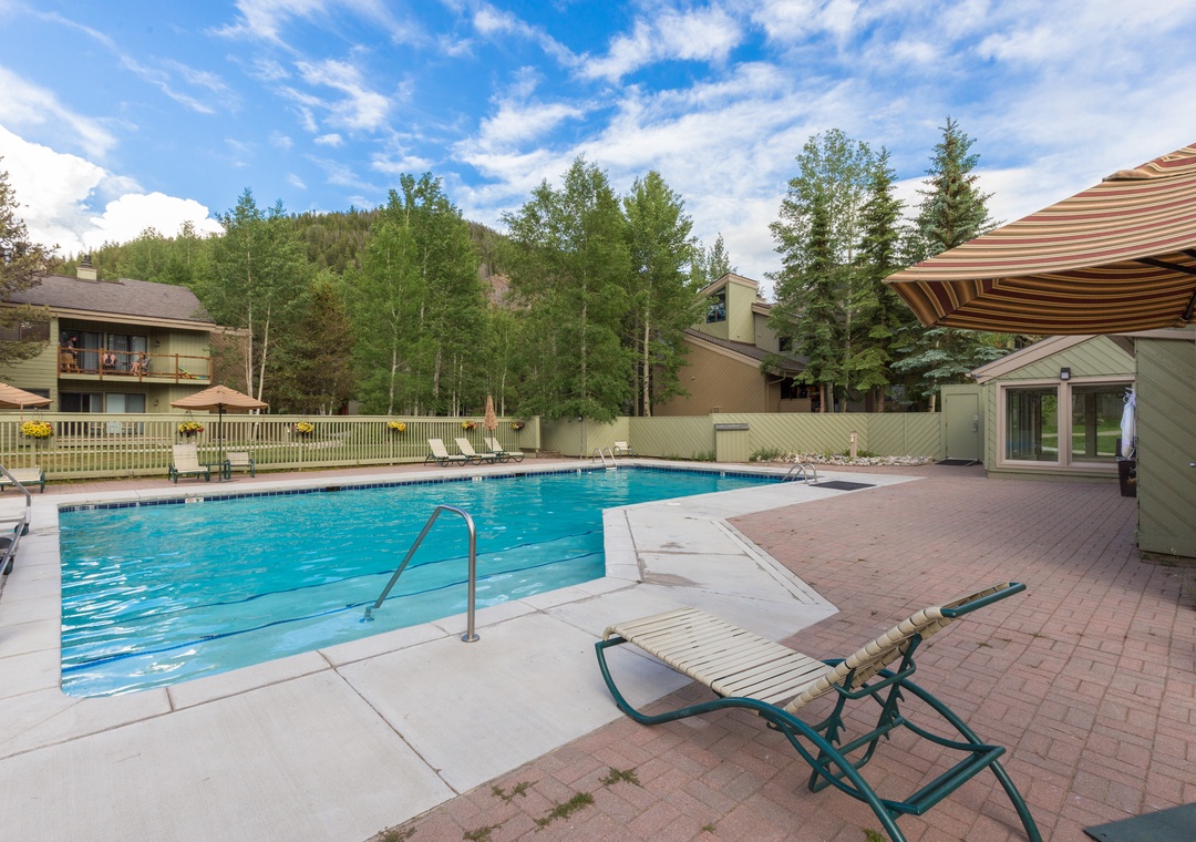 Dive into crystal-clear waters surrounded by mountain forest views. Your private poolside retreat offers peaceful moments under open skies.
