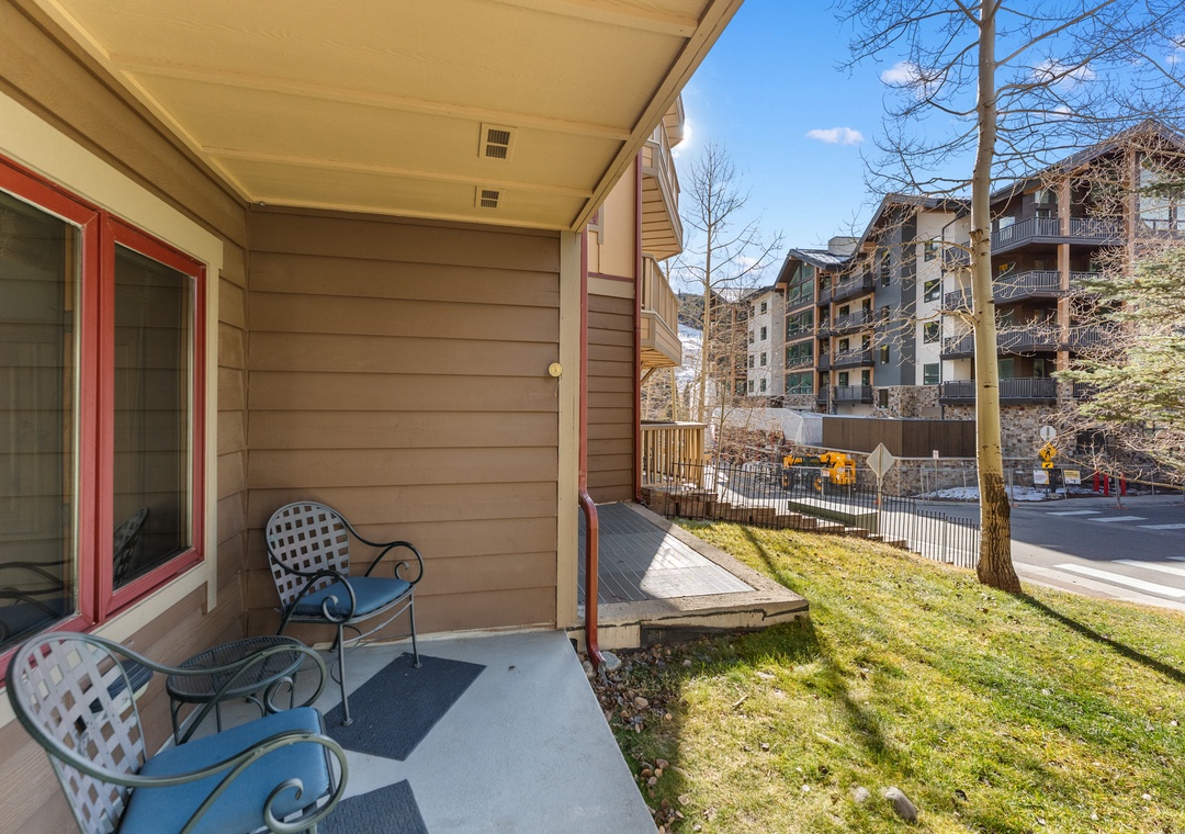 Step onto your private patio where comfortable seating awaits, perfect for morning coffee while taking in the peaceful neighborhood views.