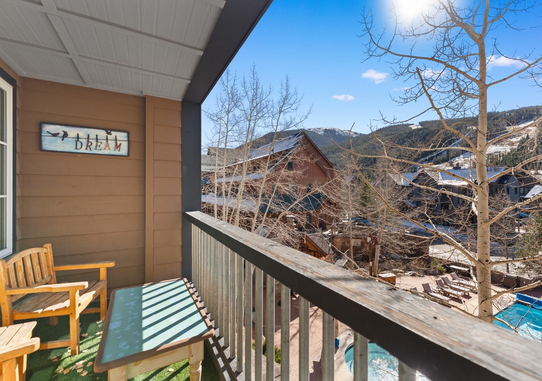 Step onto your private balcony and breathe in crisp mountain air while soaking up stunning winter alpine views from your cozy outdoor retreat.
