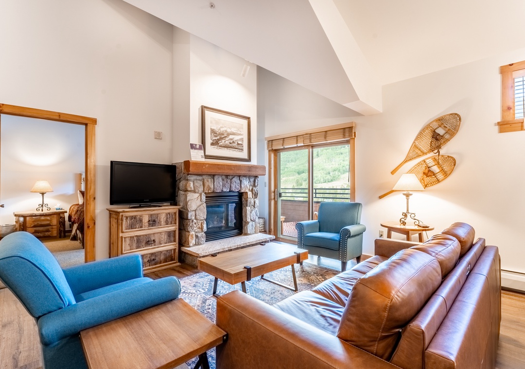 Sink into leather sofas by your stone fireplace, where mountain views and rustic charm create the perfect après-ski retreat.
