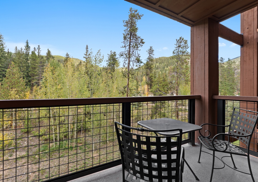 Step outside to your private balcony and soak in stunning mountain and forest views. Sip your morning coffee at the cozy table as you breathe in the crisp alpine air and admire the peaceful, natural surroundings.