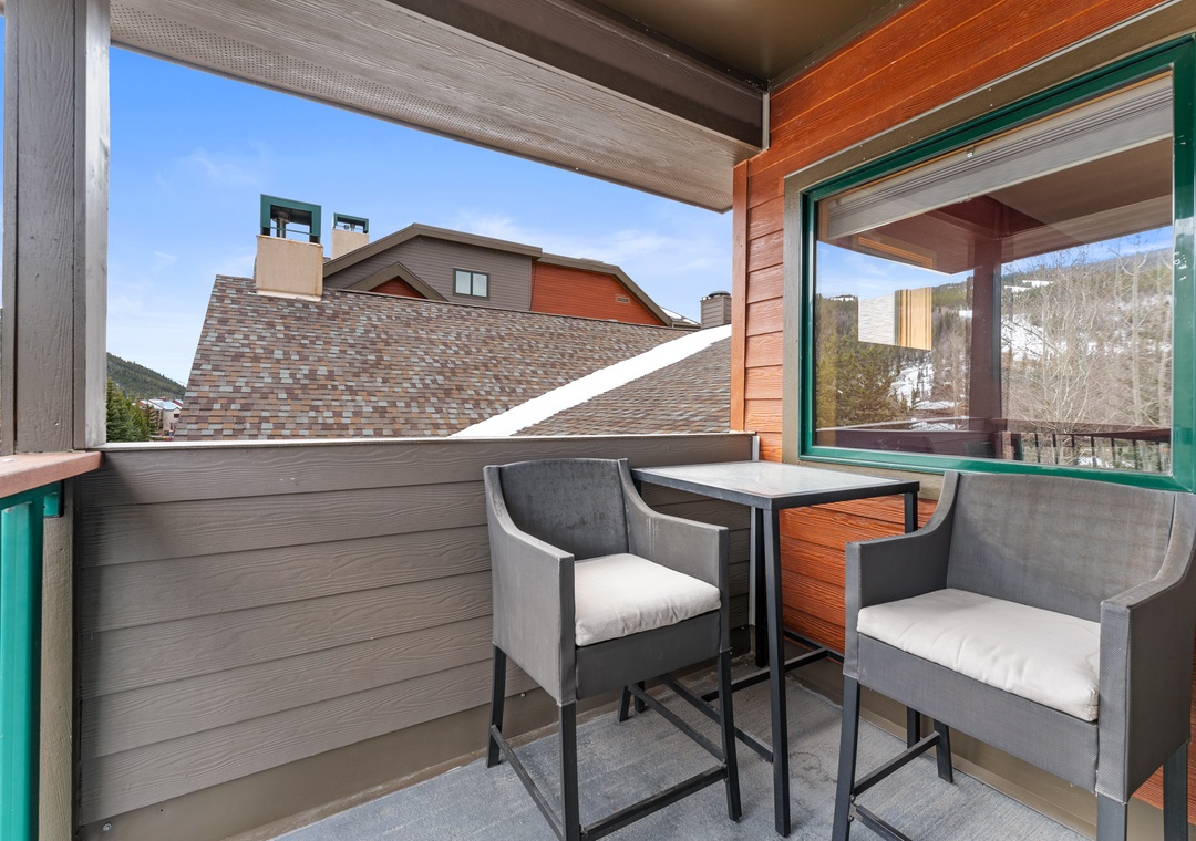 Your private balcony offers the perfect spot to sip morning coffee while taking in mountain views and charming neighborhood rooftops.