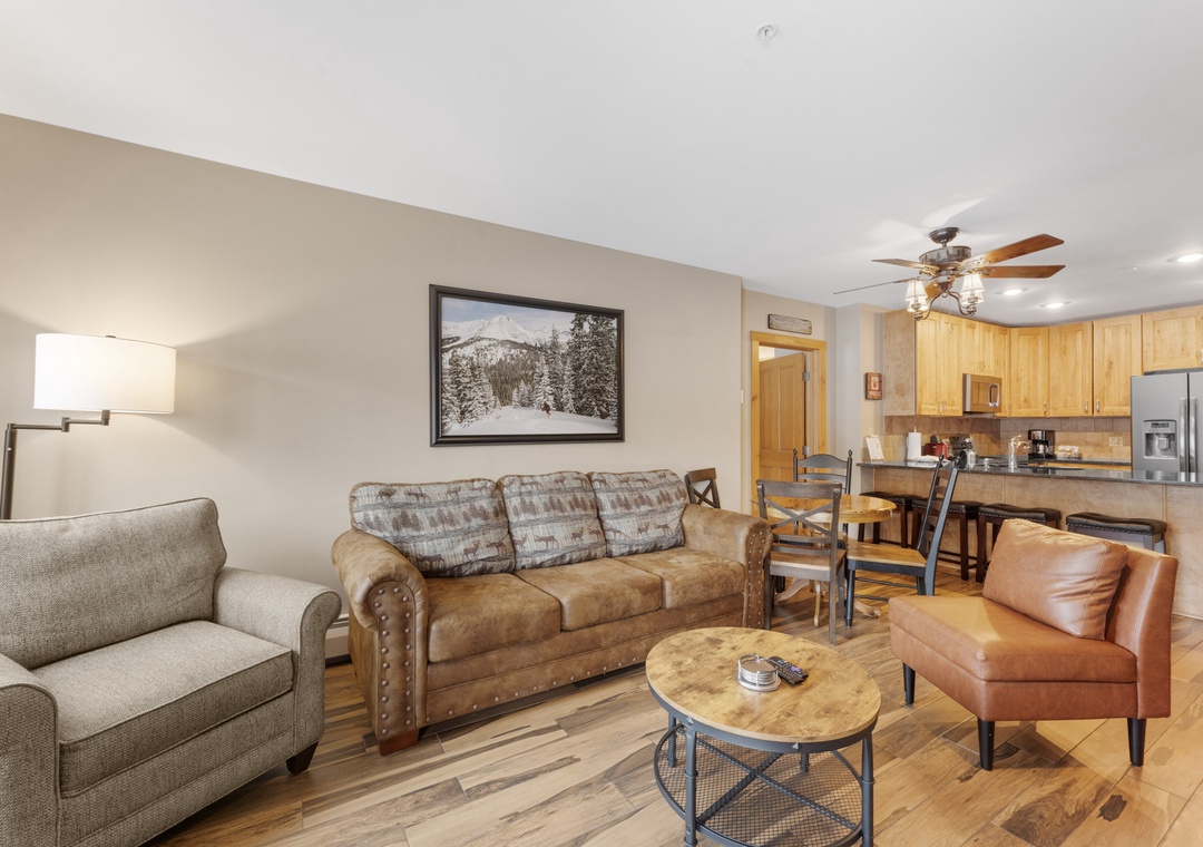 Unwind in your spacious open-concept living area with plush seating and a fully equipped kitchen ready for home-cooked meals.