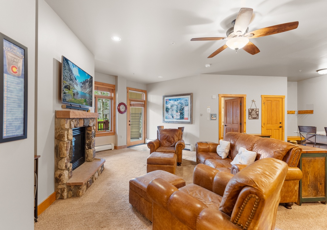 Sink into buttery leather recliners by your crackling stone fireplace, where mountain views through picture windows create the perfect backdrop for your alpine retreat.