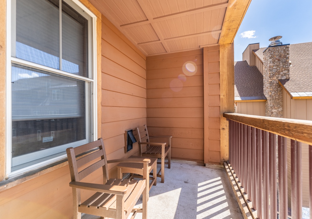 Step onto your private balcony where wooden chairs await your morning coffee or evening unwind, surrounded by mountain charm.