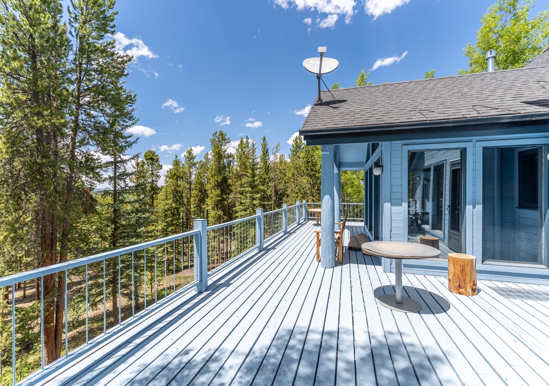 Step onto your private deck where forest views stretch endlessly before you, creating the perfect backdrop for morning coffee or evening relaxation.
