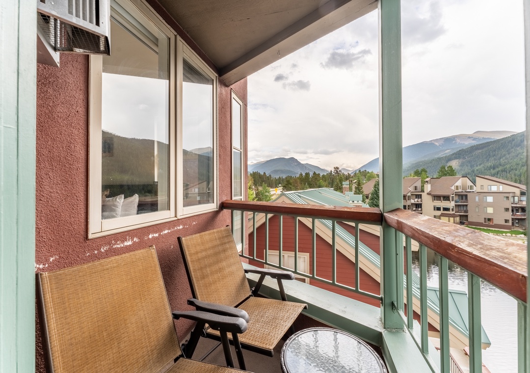 Relax on your private balcony with stunning mountain views and comfortable seating—the perfect spot for morning coffee.