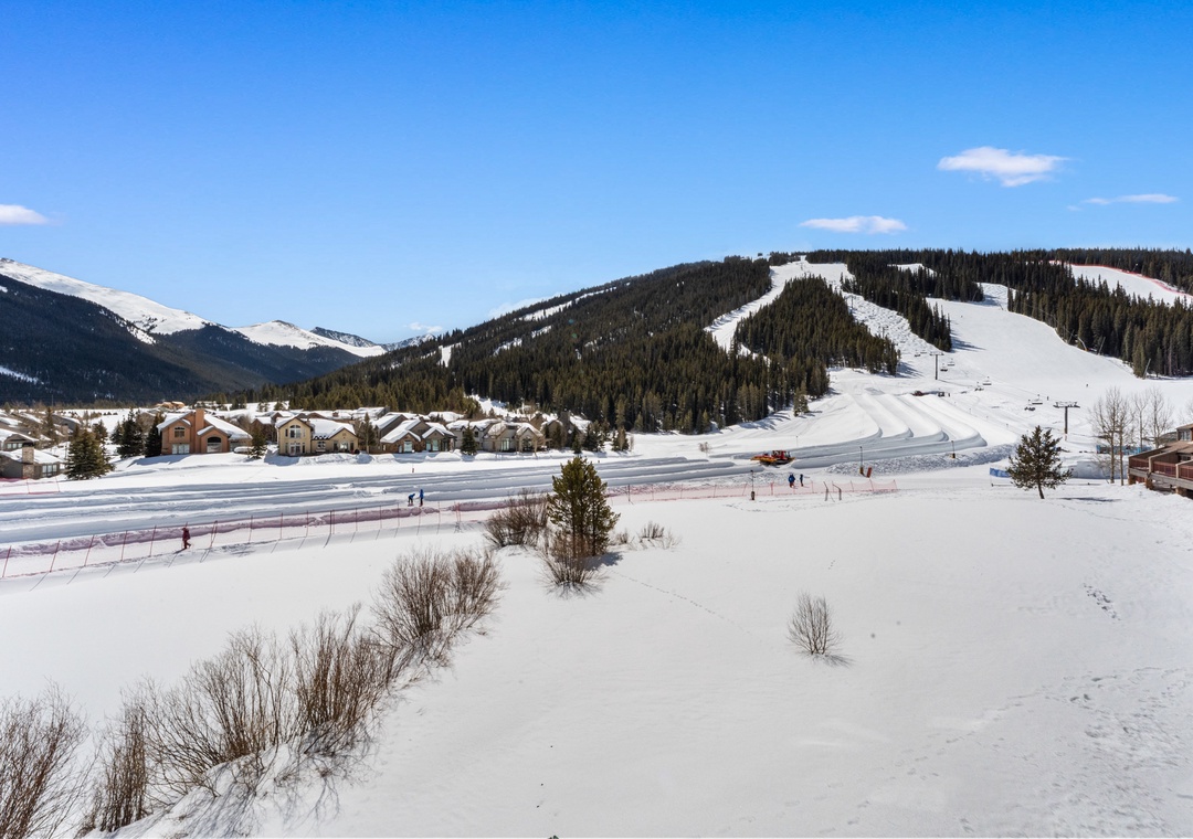 Winter wonderland awaits with pristine ski slopes and charming mountain village nestled in snow-covered peaks.
