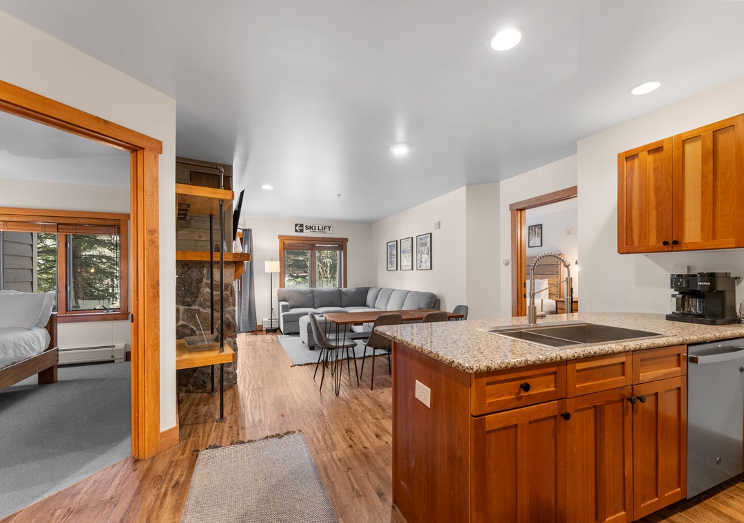 Your fully equipped kitchen flows into the living area, perfect for cooking meals while staying connected with loved ones.