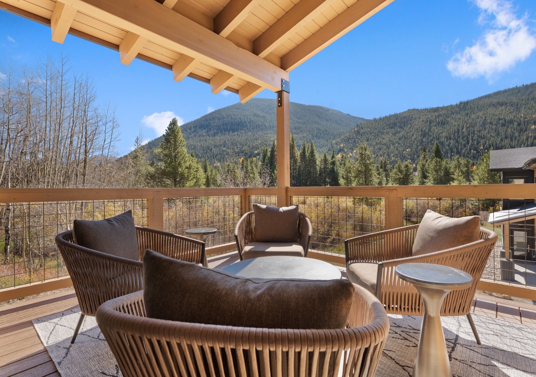 Your private deck invites you to unwind with sweeping mountain views and fresh alpine air. Sink into comfortable seating beneath warm wooden beams and let the beauty of the surrounding peaks become your backdrop.