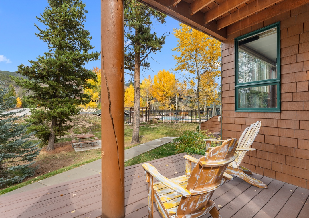 The deck showcases stunning foliage with aspen and pine trees framing the peaceful neighborhood surroundings. Settle into these Adirondack chairs for your morning coffee and breathe in the crisp mountain air.