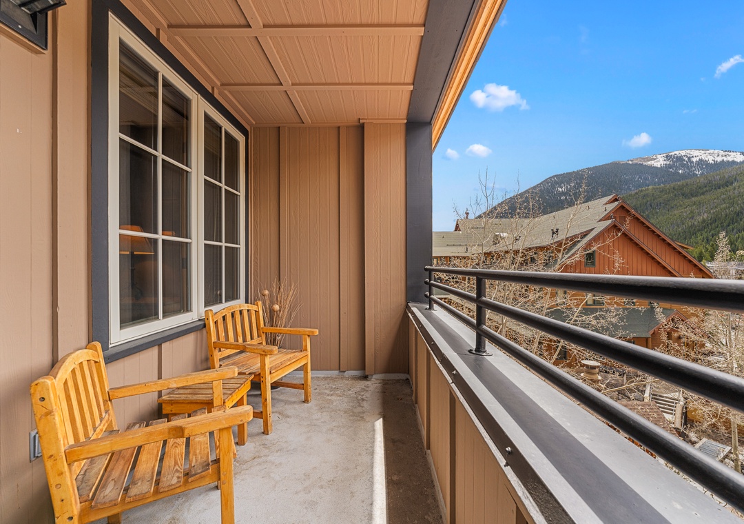 Unwind on your private balcony with mountain views, where wooden chairs invite you to sip morning coffee and soak in the alpine scenery.