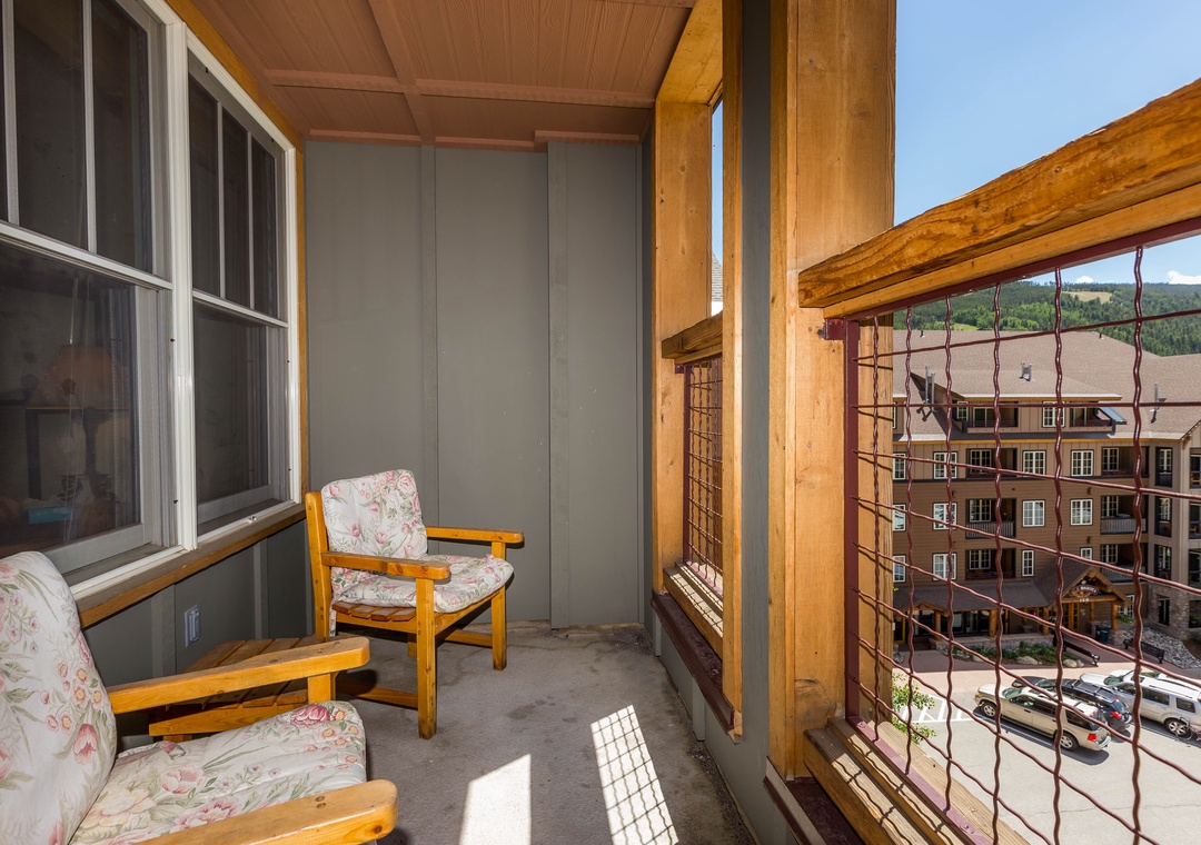 Relax on your private balcony with cozy seating and mountain views, perfect for morning coffee or evening wind-down.