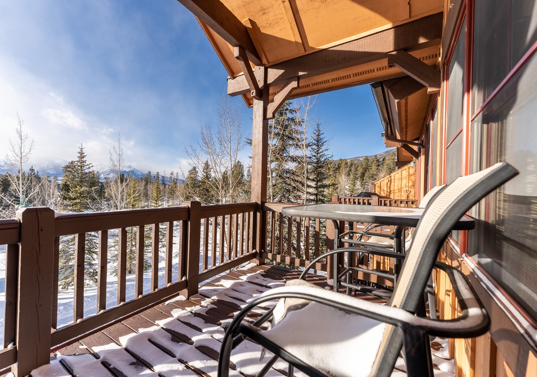 Your private mountain balcony awaits with stunning forest views and cozy seating where you can sip morning coffee while snow-capped peaks inspire pure tranquility.