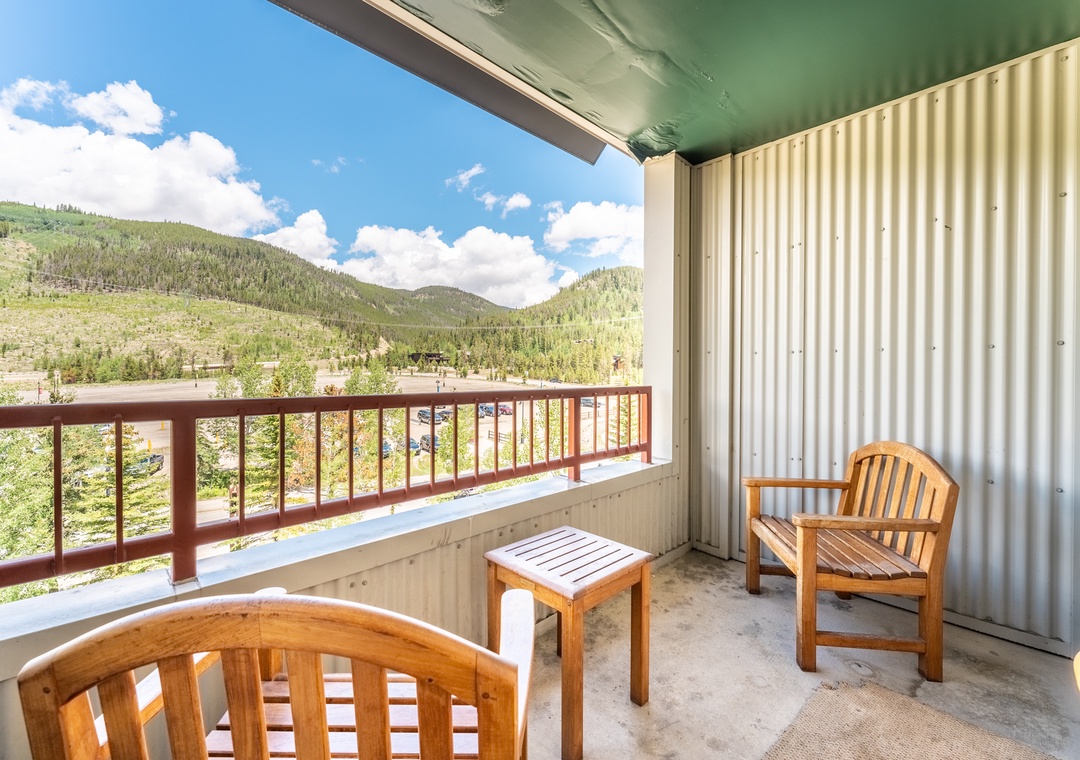 Unwind on your private mountain balcony with breathtaking forest views stretching across rolling peaks and valleys.