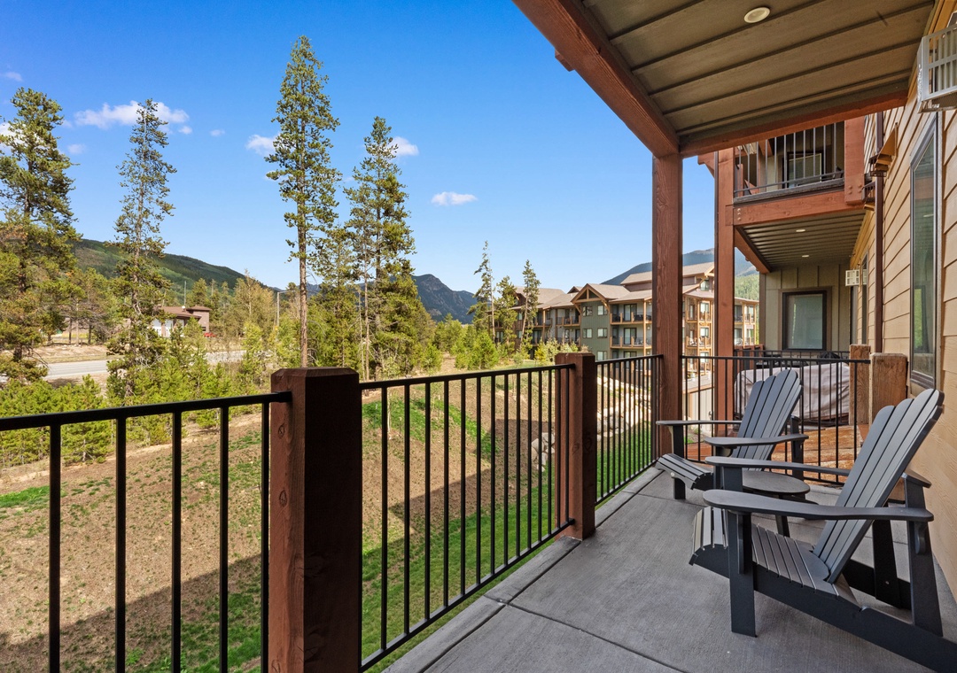 Unwind on your private balcony with mountain views, where comfortable Adirondack chairs invite you to soak in the peaceful alpine scenery.