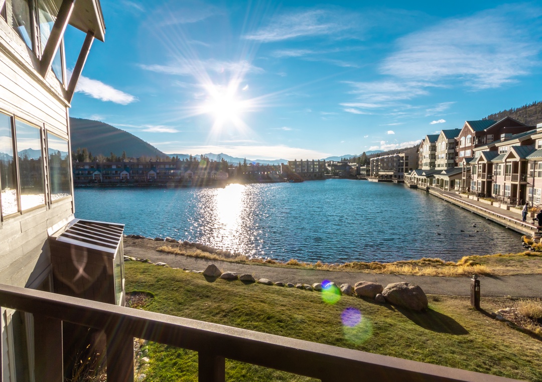 Lakefront property with stunning water views and mountain backdrop in a scenic resort community.