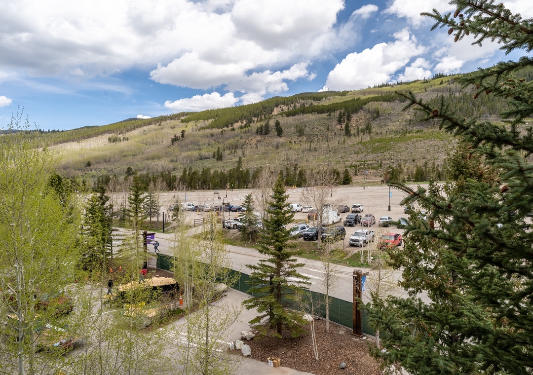 Mountain valley setting with convenient parking and outdoor recreation access amid forested hillsides and natural terrain.