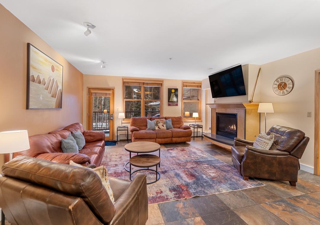 Sink into plush leather seating around your cozy fireplace, where mountain views frame perfect evenings of relaxation.
