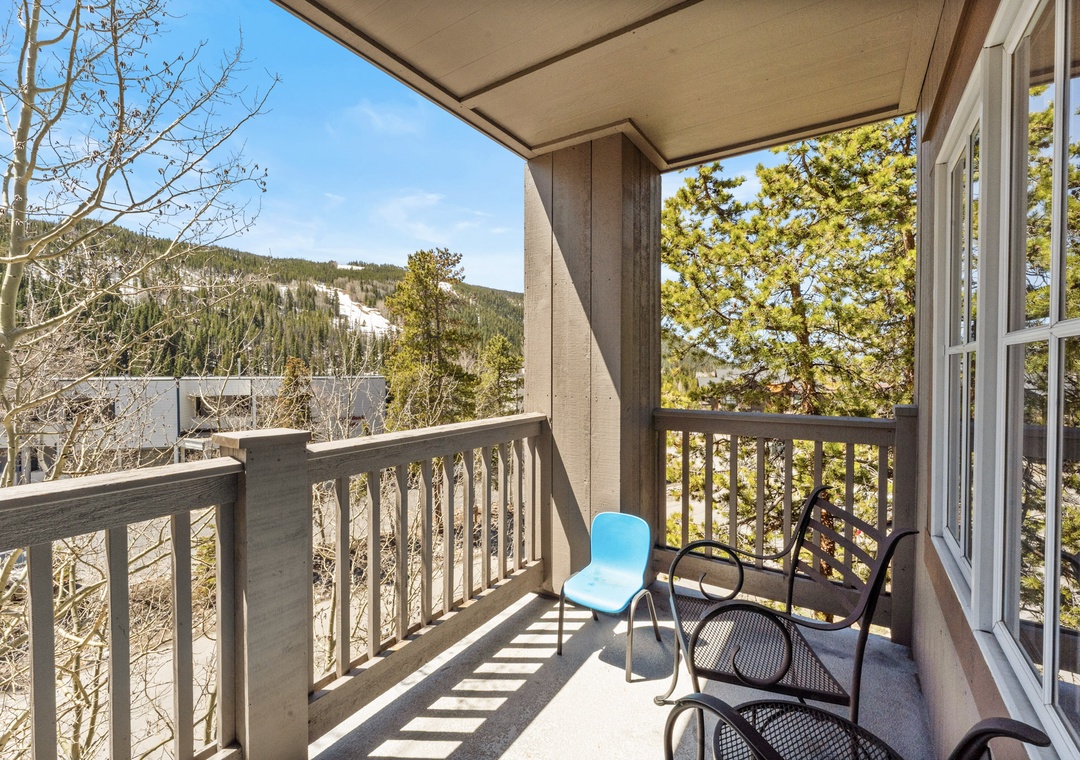 Step onto your private balcony and breathe in the mountain air while taking in stunning ski slope views from your cozy seating area.