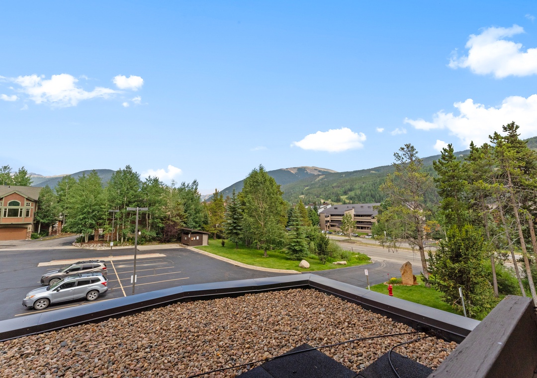 Mountain views and wooded surroundings frame this peaceful residential area with convenient parking and landscaped grounds.