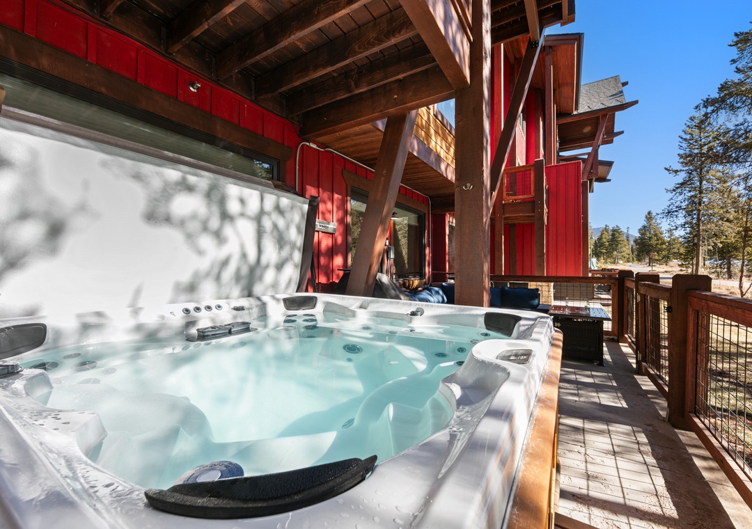 Unwind in your private hot tub on this sunny deck, where forest views and warm bubbles create the perfect mountain retreat.