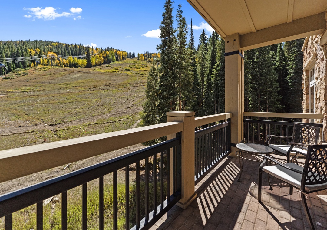 Relax on your private balcony with mountain views, enjoying coffee while surrounded by fall foliage and peaceful natural landscapes.